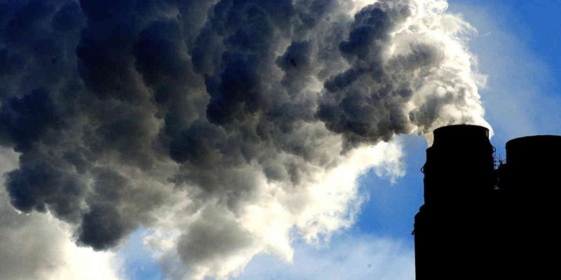 pollution pouring out of chimney into atmosphere