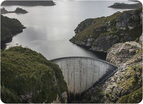 Tasmanian dam wall viewed from elevation on overcast day
