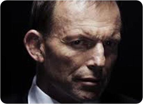 tony abbott's face looking ominous against black background