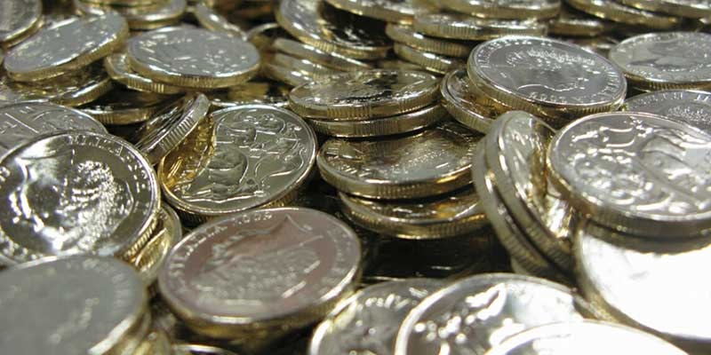 close up of dollar coins