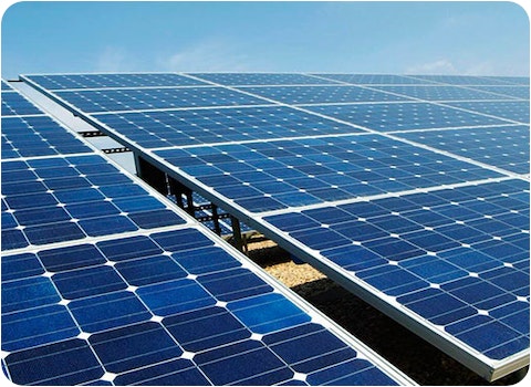 ground mounted solar panels with blue sky background
