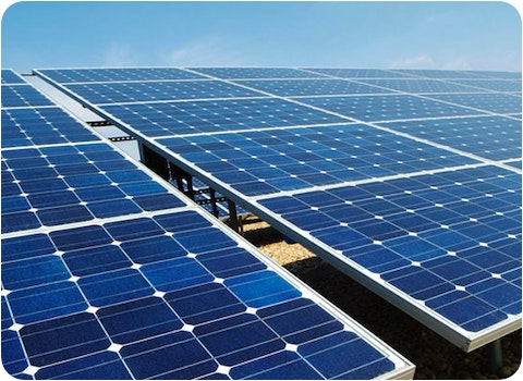 ground mount solar panels with blue sky background