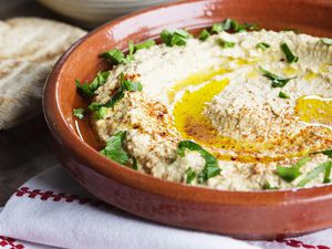 Hummus in a red bowl