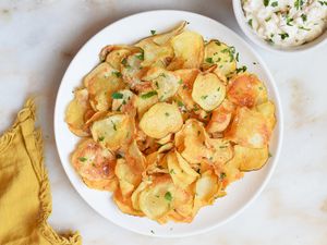 air fryer potato chips garnished with parsley on a plate