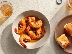 New Orleans BBQ Shrimp in a bowl, served with bread 