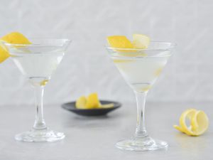 Classic gin martini garnished with lemon twists