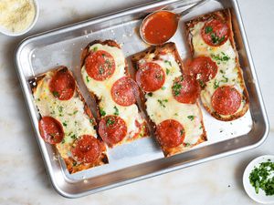 french bread pizza on a sheet tray