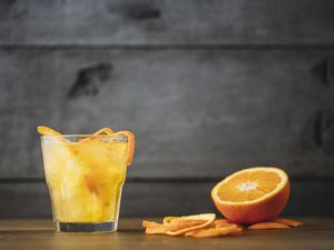 Orange juice with peeled and sliced fruit