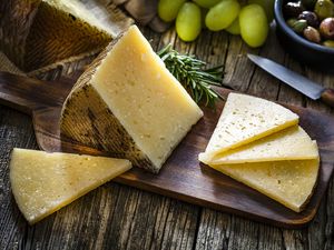Manchego cheese on a wooden board