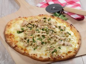 New Haven white clam apizza on a pizza peel