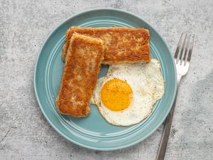 sliced fried scrapple with a fried egg