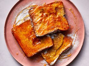 Sheet Pan French Toast topped with syrup on a plate