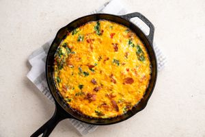 Spinach Frittata With Bacon and Cheddar in a pan 