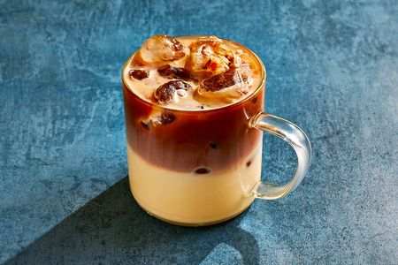 Tres Leches Cake Iced Latte in a glass cup 