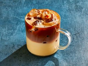 Tres Leches Cake Iced Latte in a glass cup 