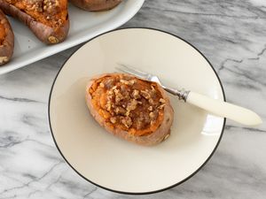 Twice-baked sweet potato on a plate with fork