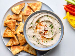 White Bean Hummus Dip (Gluten-free), served with pita chips and peppers 