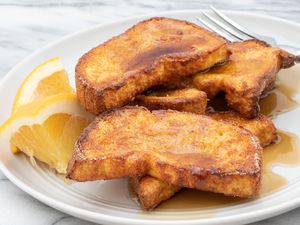 air fryer french toast on a plate with orange