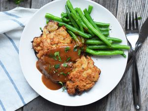 country fried steak with gravy and green beans