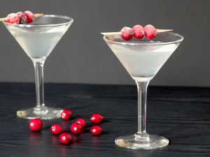White Cosmo Cocktail With Sugared Cranberry Garnish
